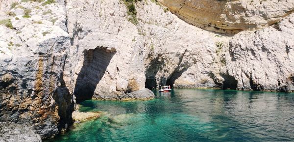 Scenic view of rock formation in sea