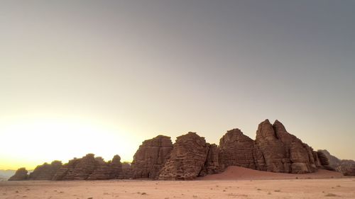 Rock formations in desert against clear sky