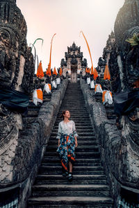 Full length of man on temple outside building