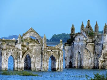 Ruins of temple against clear sky