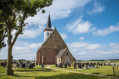 Texel, the netherlands. august 2021. the old church with cemetery in den hoorn at texel, holland.