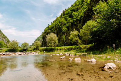 Hiking in european alps at lake with beautiful mountains and scenery