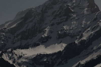 Scenic view of snowcapped mountains against sky during winter