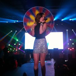 Woman singing on stage at concert