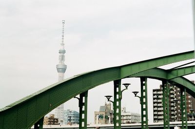 Low angle view of tokyo sky tree and bridge against sky in city
