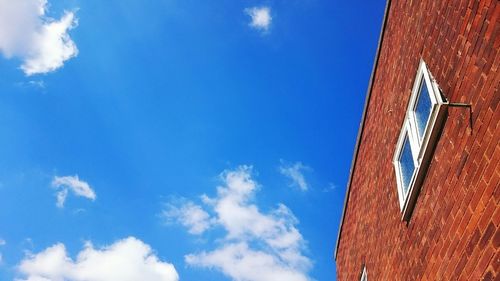 Low angle view of built structure against blue sky