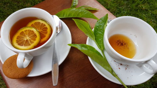 Tea cup and coffee on table