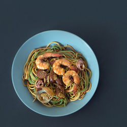 Close-up of food served on table against black background