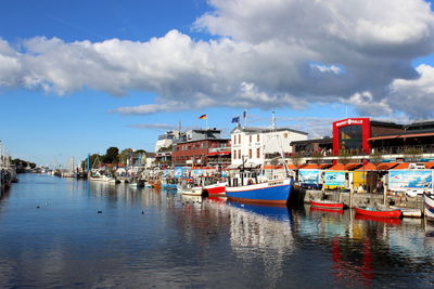 Boats moored at harbor