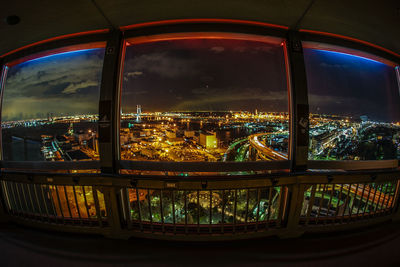 Illuminated city buildings at night