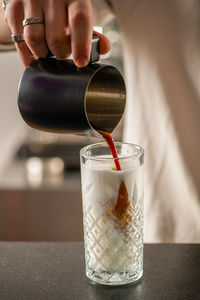 Close-up of hand holding drink