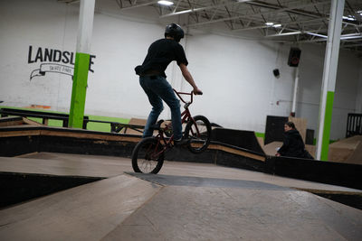 Side view of man riding bicycle