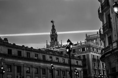 Low angle view of buildings against sky in city