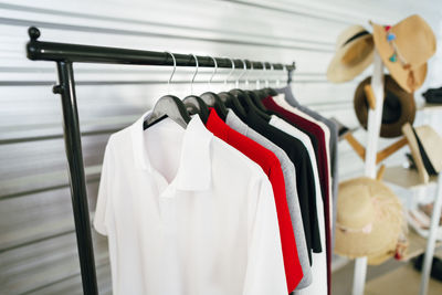 Close-up of clothes hanging on rack in store