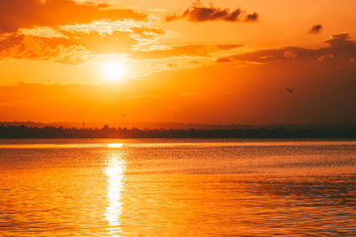 Scenic view of sea against sky during sunset