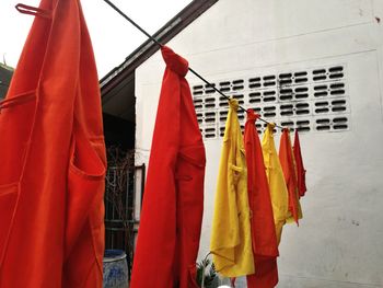 Low angle view of clothes drying against buildings