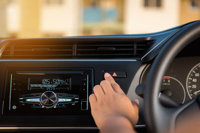 Cropped image of person in car