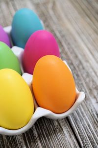 Close-up of multi colored eggs on table