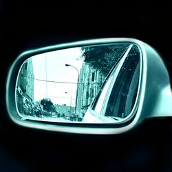 Close-up of car on road