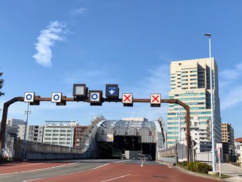 Road sign against blue sky