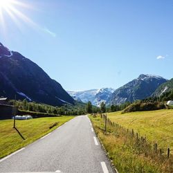 Country road leading towards mountains