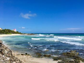 Scenic view of sea against blue sky