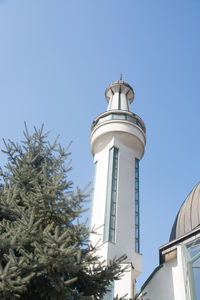 Low angle view of tower against clear blue sky