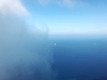 Scenic view of sea against blue sky