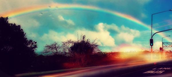 Rainbow over road