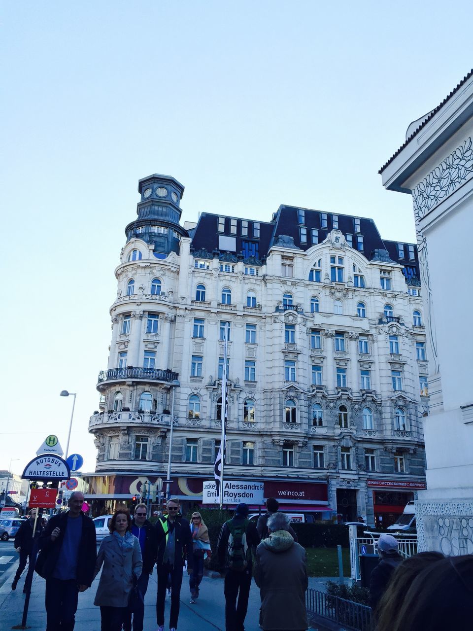 architecture, building exterior, built structure, men, clear sky, large group of people, lifestyles, famous place, person, city, travel destinations, tourism, leisure activity, capital cities, international landmark, city life, travel, tourist, copy space