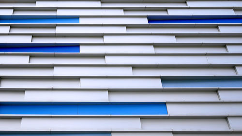 Full frame background of blue and white modern building exterior