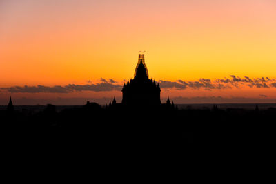 Silhouette of temple against sky during sunset