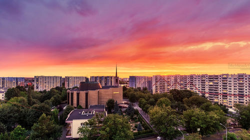 High angle view of buildings against sky during sunset