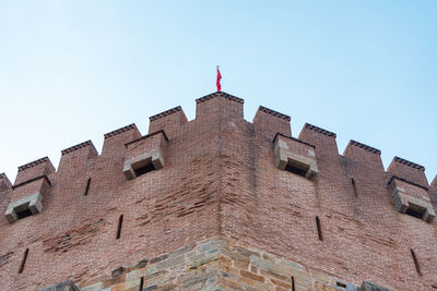 Low angle view of old building against clear sky