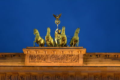 Statue of liberty against blue sky