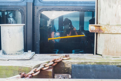 People holding glass window