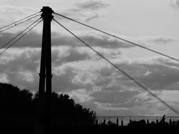 Low angle view of cables against sky