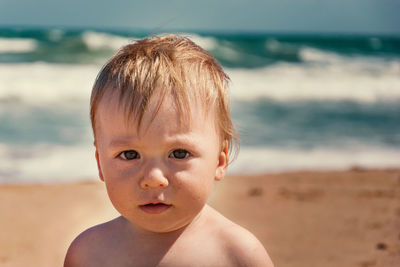 Portrait of cute boy at beach