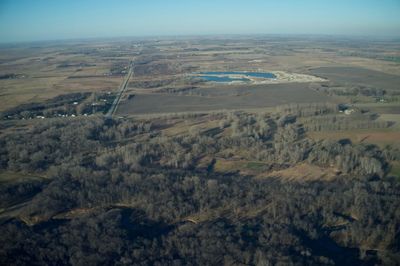 Aerial view of agricultural field against sky