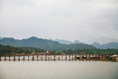 Bridge over river against sky