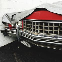 Close-up of red car on wall