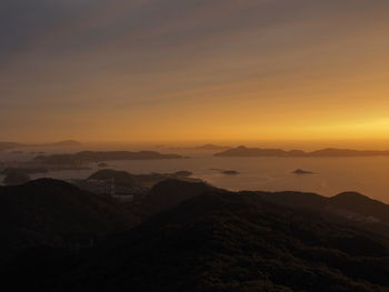 Scenic view of mountains against sky during sunset