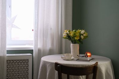 Potted plant on table at home