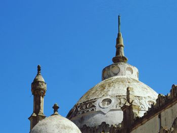 Low angle view of temple against blue sky