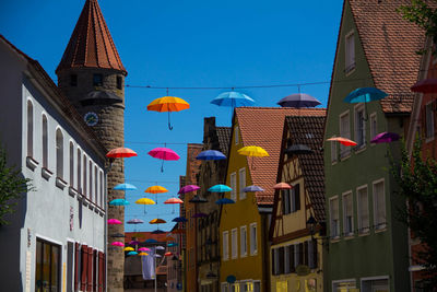 Low angle view of buildings against blue sky