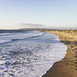 View of calm beach against sky