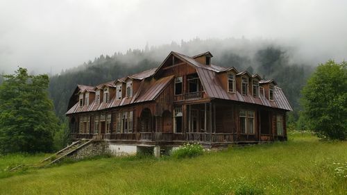 House on field against sky