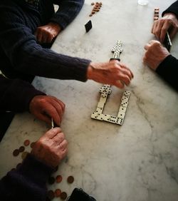 High angle view of men playing on table