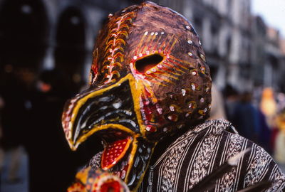 Close-up of person wearing bird mask during venice carnival