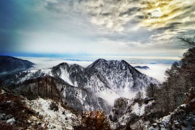 Scenic view of snowcapped mountains against sky